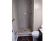 Walk-in tiled shower in this bathroom with toilet and vanity at 3088 Balearic Dr, Marietta, GA 30067