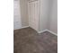 Bedroom featuring neutral carpet and a double closet with louvered doors at 3088 Balearic Dr, Marietta, GA 30067
