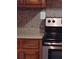 Kitchen features tiled backsplash, stainless appliances, and wood cabinetry at 3088 Balearic Dr, Marietta, GA 30067