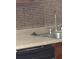 Stainless steel kitchen sink features modern faucet and soap dispenser at 3088 Balearic Dr, Marietta, GA 30067