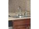 Stainless steel kitchen sink features modern faucet and soap dispenser at 3088 Balearic Dr, Marietta, GA 30067