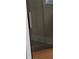 Enclosed shower featuring glass doors, wood flooring and updated finishes at 3088 Balearic Dr, Marietta, GA 30067