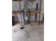 Water heater with connections and some shelving units in the basement at 3088 Balearic Dr, Marietta, GA 30067