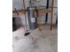 Water heater with connections and some shelving units in the basement at 3088 Balearic Dr, Marietta, GA 30067