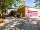 Driveway leading to a house with a pink garage door at 3290 Custer Lake Nw Dr, Marietta, GA 30064