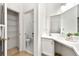 Bathroom featuring vanity, countertop, storage and door to a private lavatory at 406 Vinings Forest Se Cir, Smyrna, GA 30080