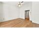 Bedroom featuring hardwood floors, ceiling fan, and interior door at 406 Vinings Forest Se Cir, Smyrna, GA 30080