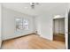 Bedroom featuring hardwood floors, ceiling fan, window and interior door at 406 Vinings Forest Se Cir, Smyrna, GA 30080