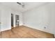 Bedroom featuring hardwood floors, ceiling fan, and view to bath at 406 Vinings Forest Se Cir, Smyrna, GA 30080