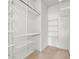 Walk-in closet with custom shelving provides plenty of storage space at 406 Vinings Forest Se Cir, Smyrna, GA 30080