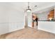 Dining space with hardwood floors open to kitchen featuring wood cabinets at 406 Vinings Forest Se Cir, Smyrna, GA 30080