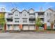 Modern condo building with well-maintained landscaping and convenient garage access at 406 Vinings Forest Se Cir, Smyrna, GA 30080