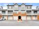 Exterior view of a three story condo building with brick facade, garages and balconies at 406 Vinings Forest Se Cir, Smyrna, GA 30080