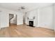 Bright living room with hardwood floors, white fireplace, ceiling fan and neutral walls at 406 Vinings Forest Se Cir, Smyrna, GA 30080