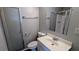 This gray bathroom features a shower with a frosted glass door and a vanity at 5266 Long Green Ln, Stone Mountain, GA 30088