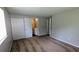 A carpeted bedroom that features a closet and a bathroom at 5266 Long Green Ln, Stone Mountain, GA 30088
