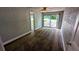Carpeted bedroom with sliding glass doors at 5266 Long Green Ln, Stone Mountain, GA 30088