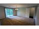 Cozy dining area with sliding glass door to yard, contemporary lighting, and neutral carpeting at 5266 Long Green Ln, Stone Mountain, GA 30088