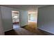 Open-concept living space with a seamless flow into the modern kitchen, and an adjacent dining area at 5266 Long Green Ln, Stone Mountain, GA 30088