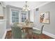 Bright dining area featuring table with four chairs, hardwood flooring and natural lighting at 974 Greenwood Ne Ave # 6, Atlanta, GA 30306