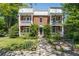 Charming brick townhouse featuring double balconies and lush landscaping at 974 Greenwood Ne Ave # 6, Atlanta, GA 30306
