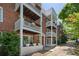 Brick townhouse with multi-level balconies, offering a unique outdoor living space at 974 Greenwood Ne Ave # 6, Atlanta, GA 30306