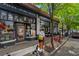 Attractive restaurant exterior with outdoor seating, showcasing architectural details and a lively atmosphere on a sunny day at 974 Greenwood Ne Ave # 6, Atlanta, GA 30306
