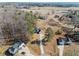 Aerial view of multiple homes in a rural area with large lots surrounded by trees at 104 Federal Path, Temple, GA 30179