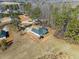 Aerial view of a home with a large backyard, surrounded by trees and nature at 104 Federal Path, Temple, GA 30179