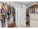 Organized walk-in closet with shelving, rods for hanging clothes, shoe racks, and ample storage space at 104 Federal Path, Temple, GA 30179