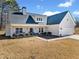 Charming home featuring a modern design with a welcoming front porch and well-manicured landscaping at 104 Federal Path, Temple, GA 30179