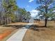 A beautiful home in the country with a long driveway leading to the house at 104 Federal Path, Temple, GA 30179