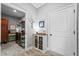 Functional laundry room with modern appliances, ample cabinet space, shelving, and a utility sink at 104 Federal Path, Temple, GA 30179