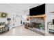 Cozy living room featuring a stone fireplace, neutral paint, and comfortable chair at 104 Federal Path, Temple, GA 30179
