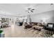 Open-concept living space with hardwood floors and a comfortable seating area at 104 Federal Path, Temple, GA 30179