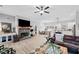 Open-concept space featuring a fireplace and open access to kitchen and dining area at 104 Federal Path, Temple, GA 30179