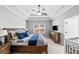 Serene main bedroom showcases a trey ceiling, a cozy sitting area, and ample natural light at 104 Federal Path, Temple, GA 30179
