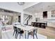 Open concept kitchen/dining/living with hardwood floors and sliding doors to outdoor patio at 11189 Serenbe Ln, Chattahoochee Hills, GA 30268