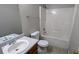 Bathroom features a tub-shower combo with a single sink vanity at 1780 Spring Hill Cv, Lithonia, GA 30058