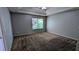 Spacious bedroom with carpet flooring, neutral walls, and a window, offering a comfortable retreat at 1780 Spring Hill Cv, Lithonia, GA 30058