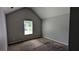 Bedroom featuring neutral walls, carpet flooring, and a window providing natural light at 1780 Spring Hill Cv, Lithonia, GA 30058