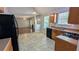 Well-lit kitchen and open concept living room with fireplace at 1780 Spring Hill Cv, Lithonia, GA 30058