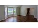 View of the living room featuring vaulted ceiling and staircase at 1780 Spring Hill Cv, Lithonia, GA 30058