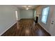 Cozy living room showcasing wood-look floors, a fireplace, and natural light, offering a comfortable living space at 1780 Spring Hill Cv, Lithonia, GA 30058
