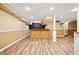 Finished basement featuring a stylish bar area, wood-look floors, and neutral paint at 3932 Granger Dr, Brookhaven, GA 30341
