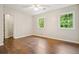 Bedroom with hardwood floors, natural light and closet at 3932 Granger Dr, Brookhaven, GA 30341