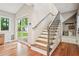 Hallway and staircase featuring a built-in bench with a backyard view at 3932 Granger Dr, Brookhaven, GA 30341