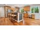 Spacious kitchen boasts stainless steel appliances, wood cabinets, and an island with barstool seating at 3932 Granger Dr, Brookhaven, GA 30341