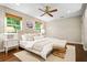 Calm main bedroom with neutral tones and ample natural light, featuring a cozy seating area at 3932 Granger Dr, Brookhaven, GA 30341