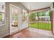Relaxing screened-in porch with hanging chair and views of the backyard at 3932 Granger Dr, Brookhaven, GA 30341